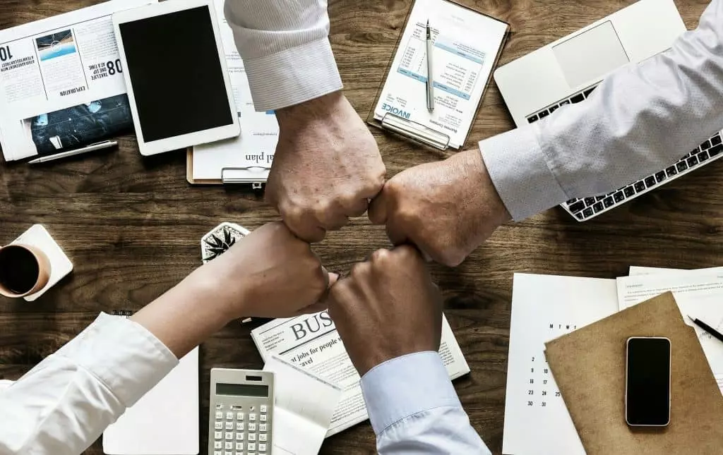 Fist bump of a team