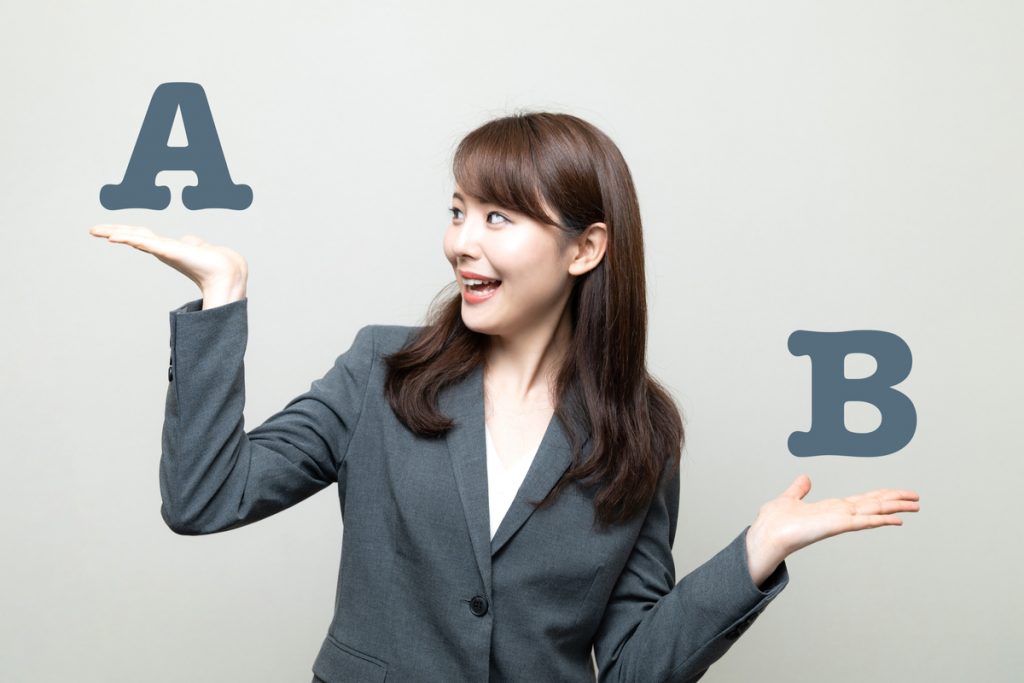 Woman comparing the letter A to the letter B.