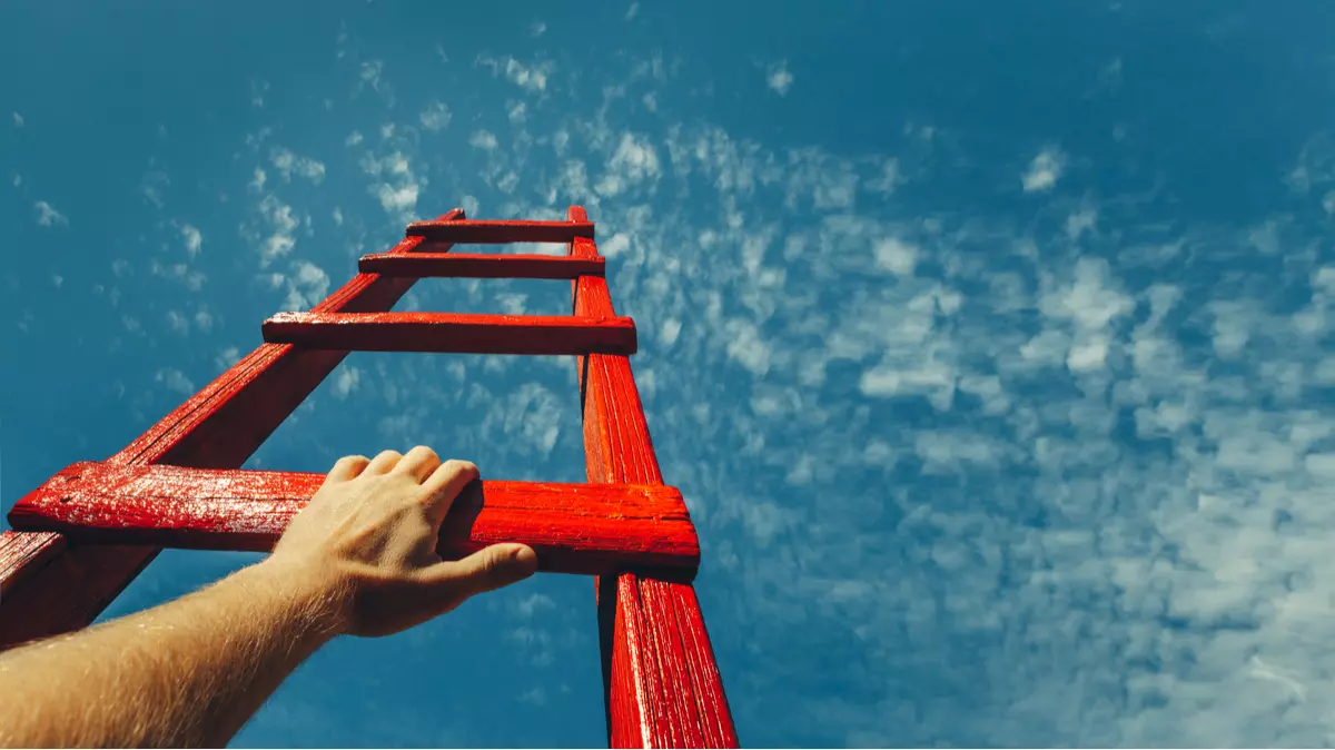 Red ladder leading up to the sky.