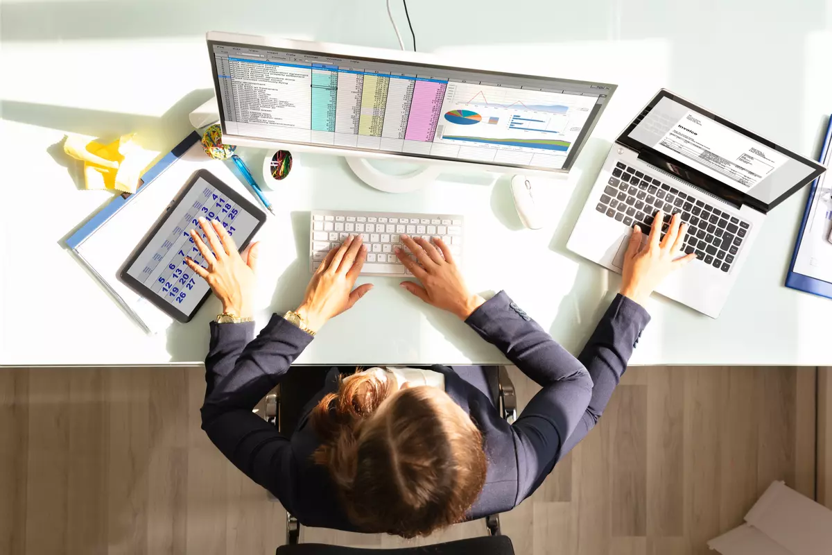 Woman multitasking at a desk