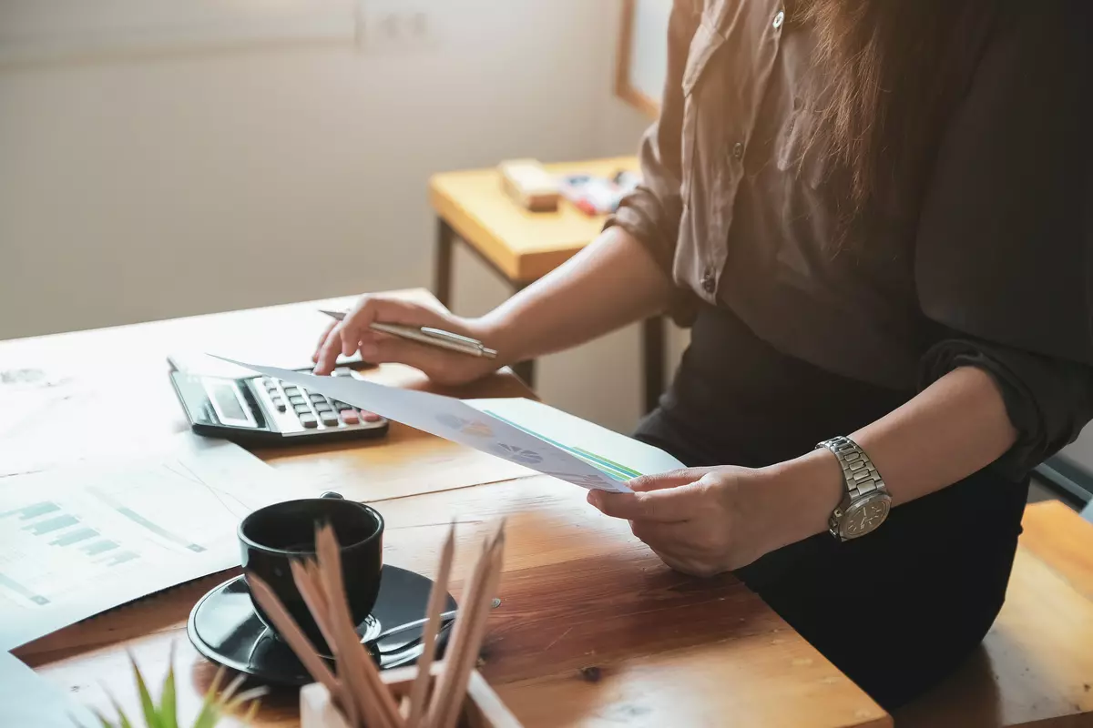 Woman checking debt docs