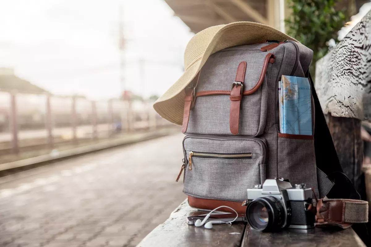 Suitcase near train tracks.