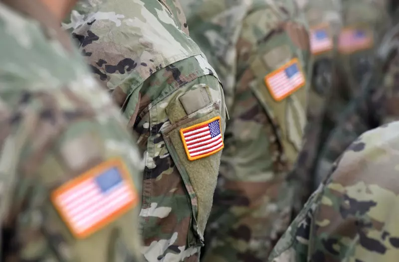 US troops standing in a group.