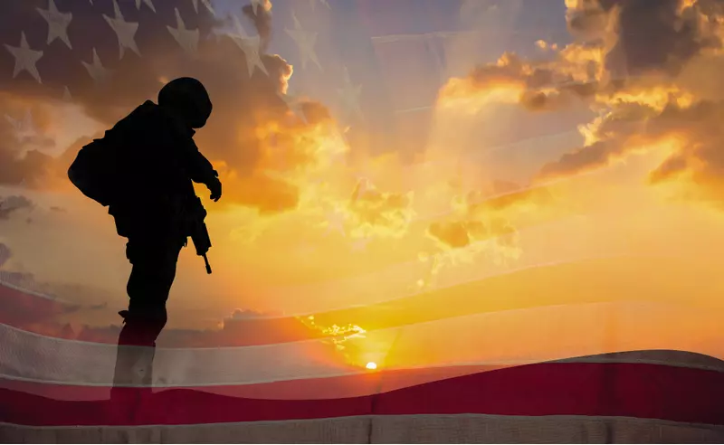 A US military man and sunset.