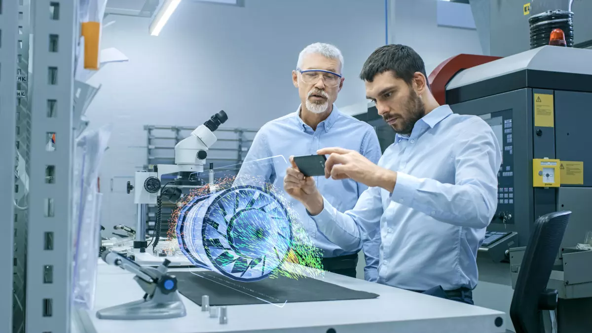 Man teaches another man how to use AR in the workplace.