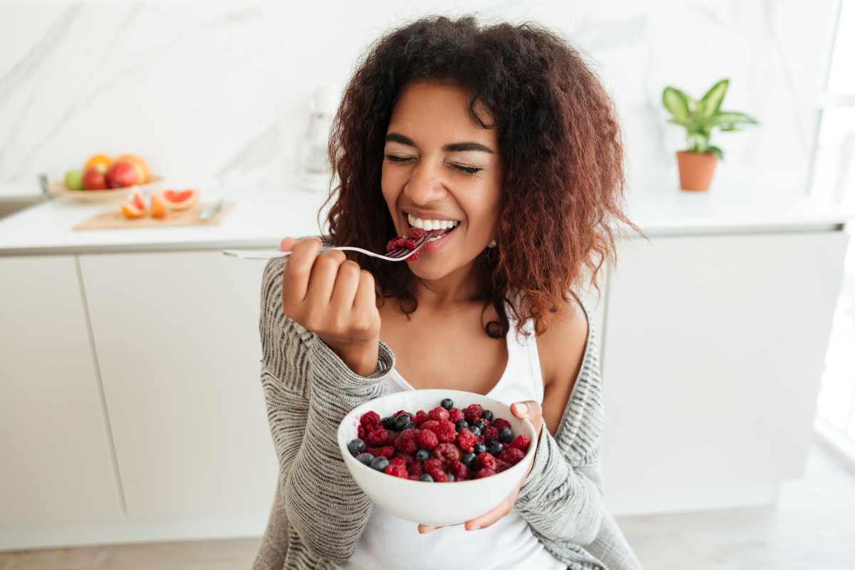 A woman eating a healthy snack.