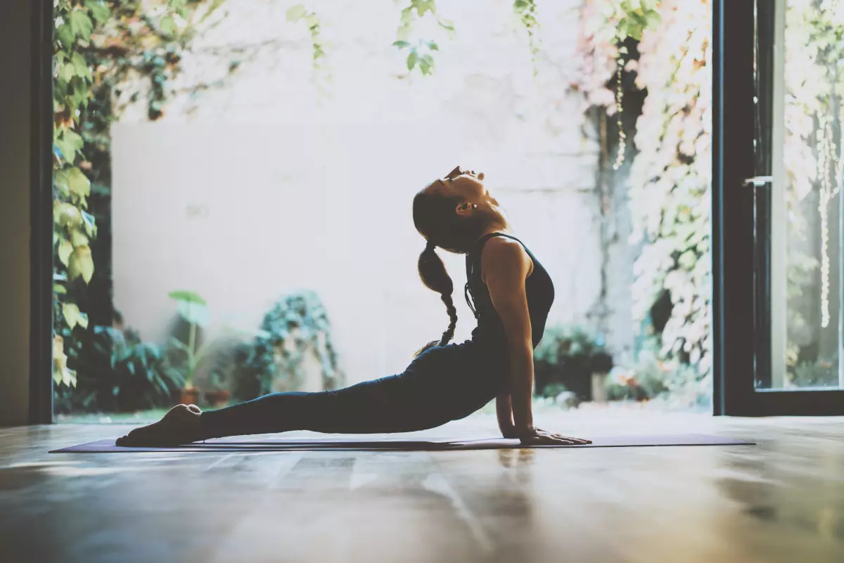 A woman practicing yoga. 