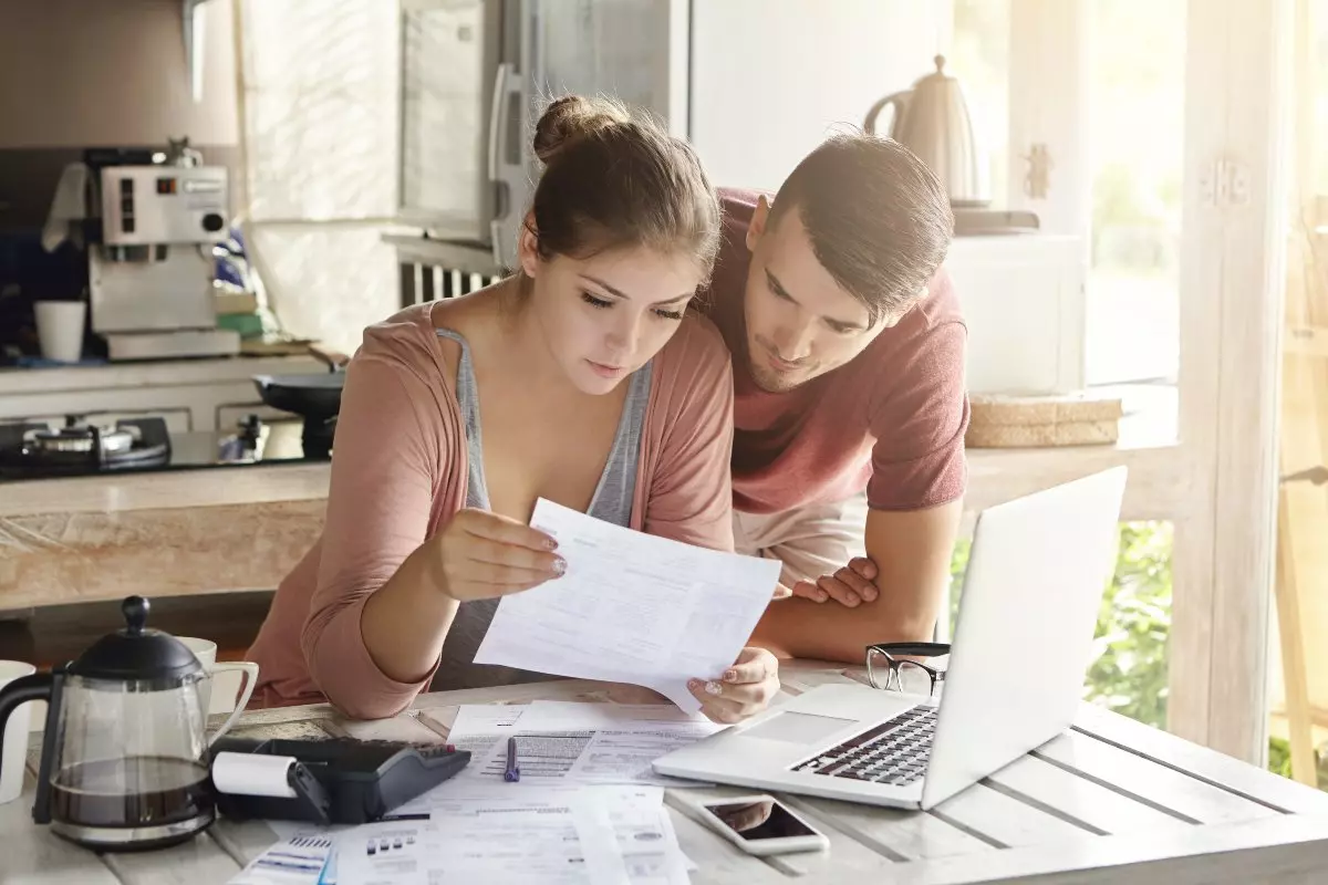 Young couple budgeting finances.