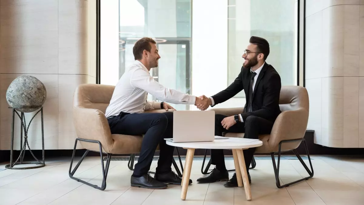 Business professionals shaking hands.