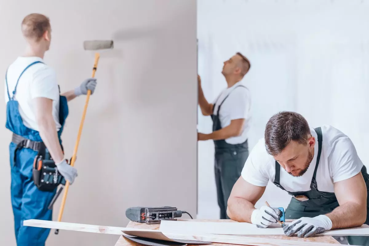 Professional painters painting interior.