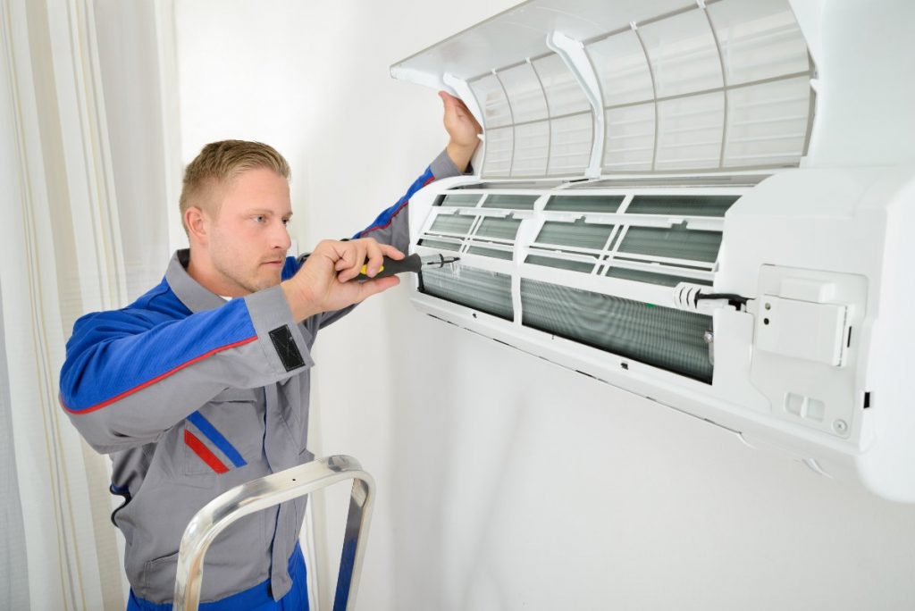 Professional installing air conditioning system.