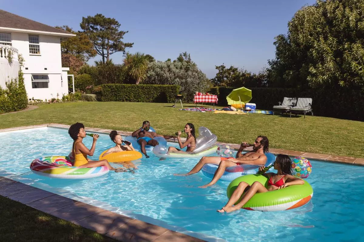 Young adults relaxing in pool.