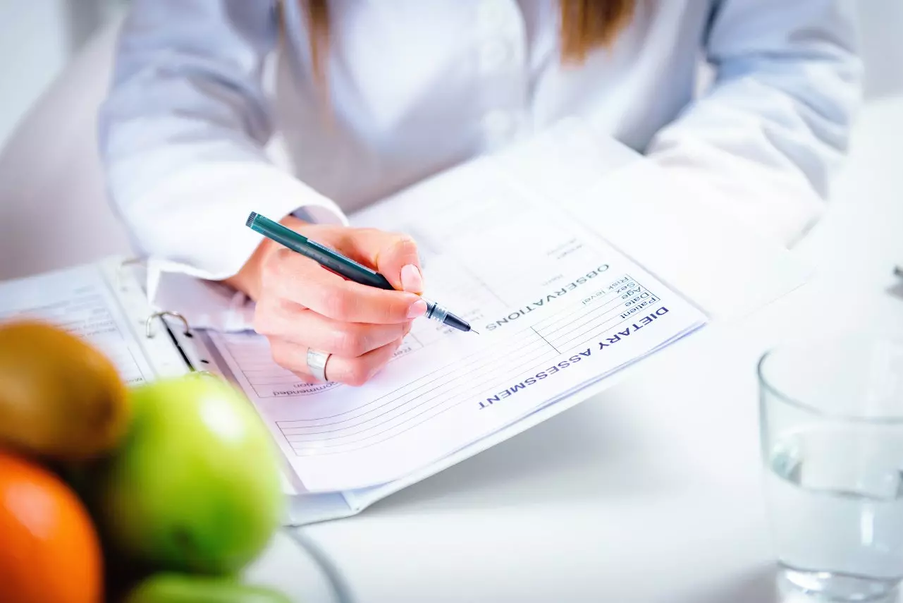 Dietician completing "dietary assessment" form