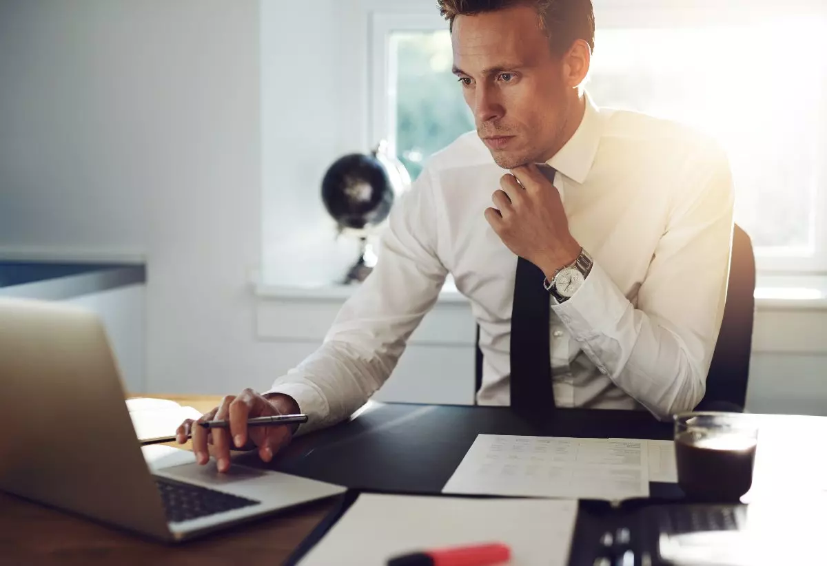 Law clerk researching on laptop