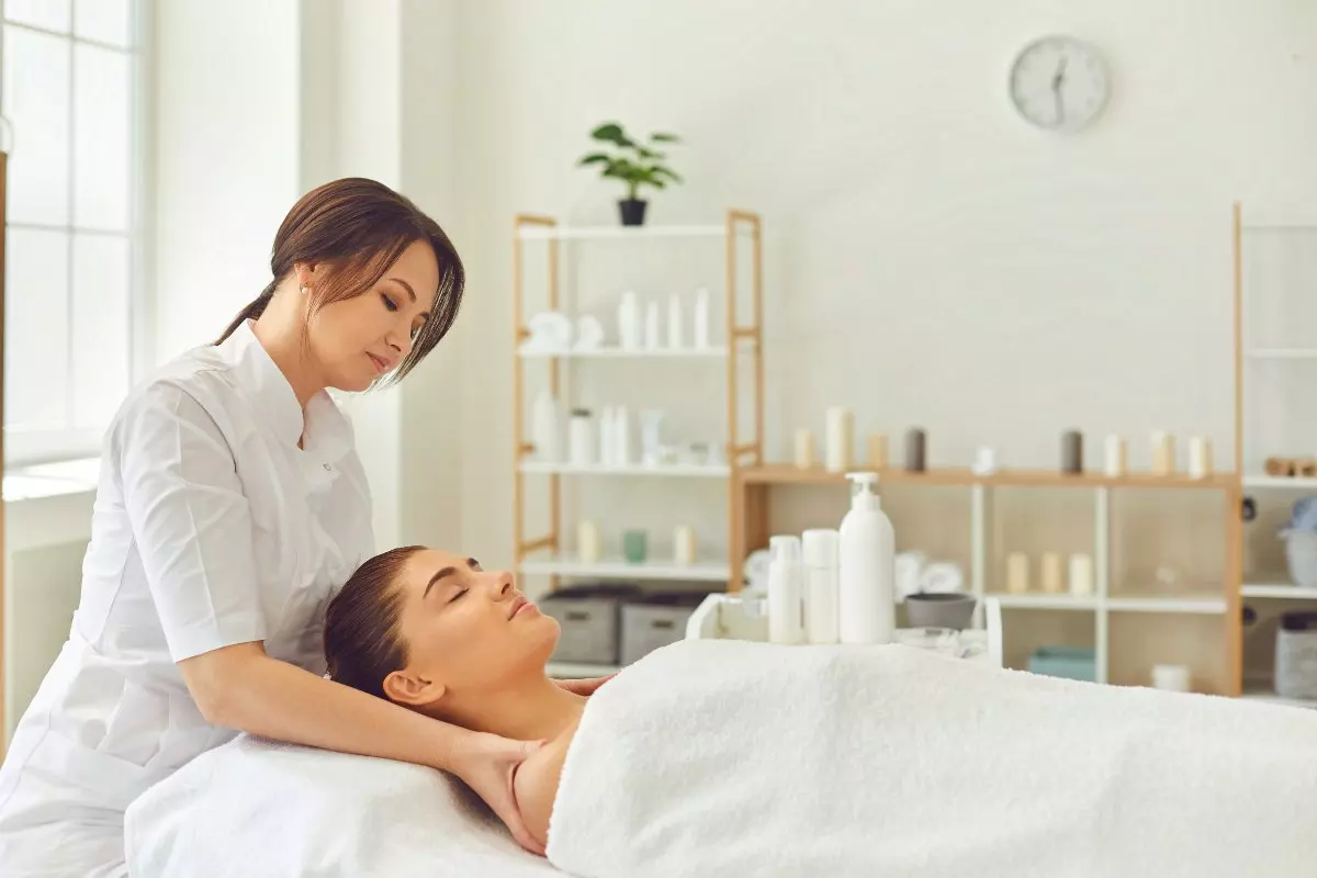 Massage therapist massaging client.