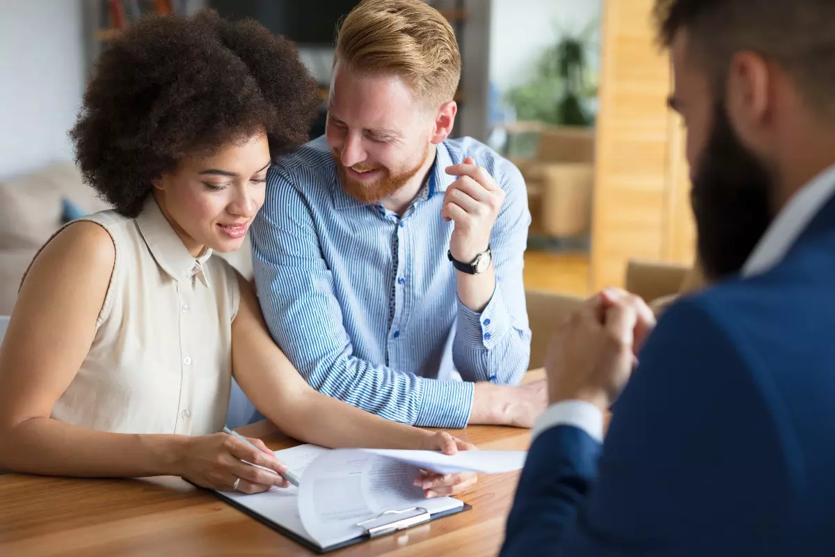 Loan applicant and cosigner meeting with financial advisor