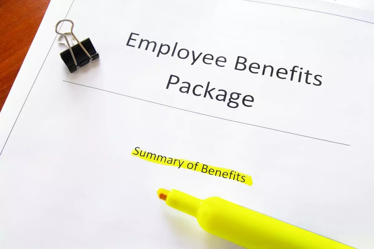 Close up on employee benefits package and highlighter