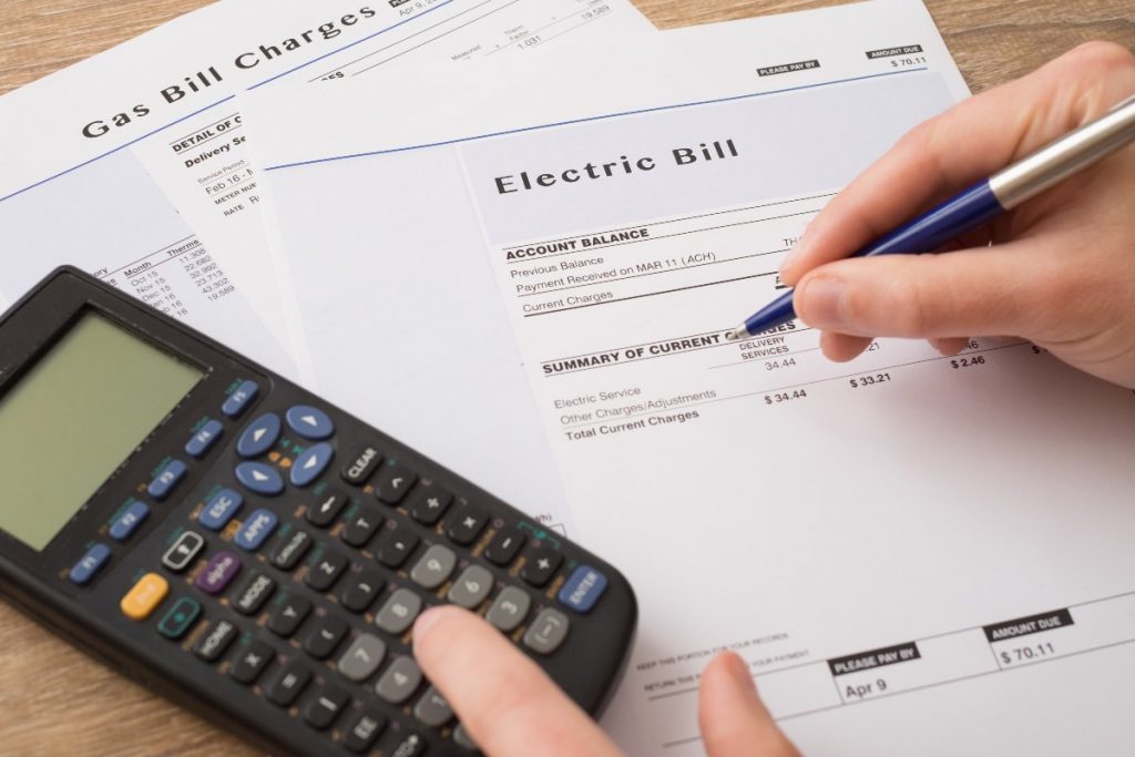 Close up on electric bill and calculator