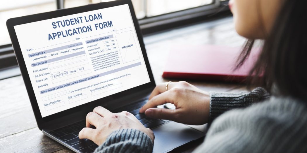 Young adult filling out student loan forgiveness form online