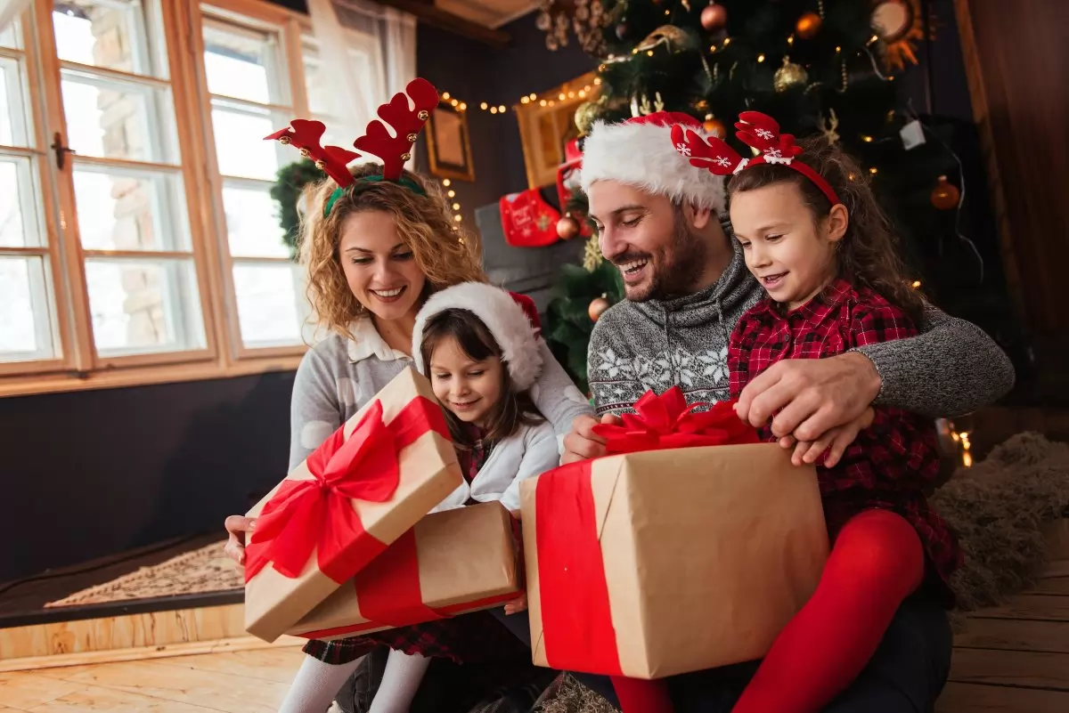 Family opening up gifts during the holidays.