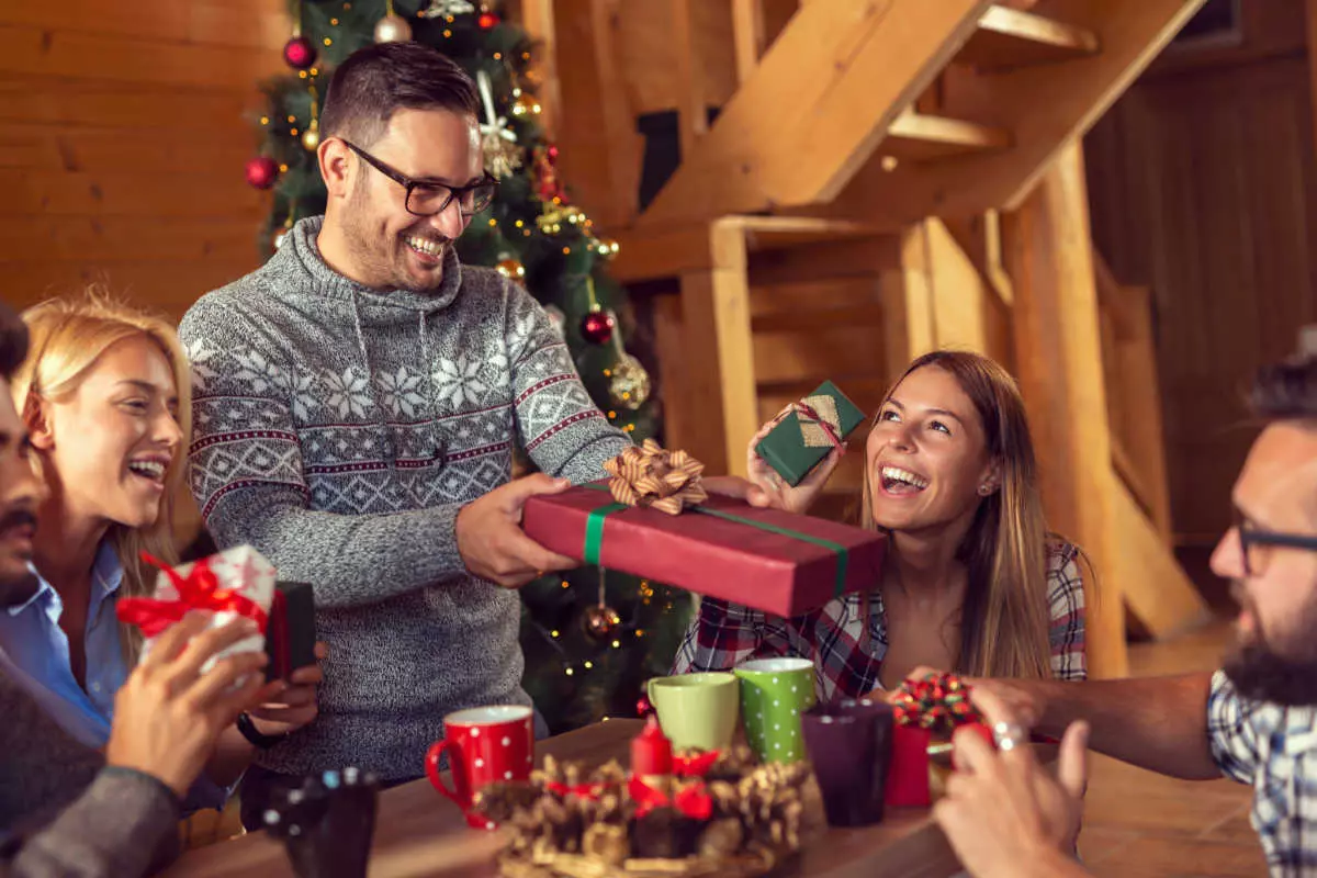 Group of friends exchanging gifts 