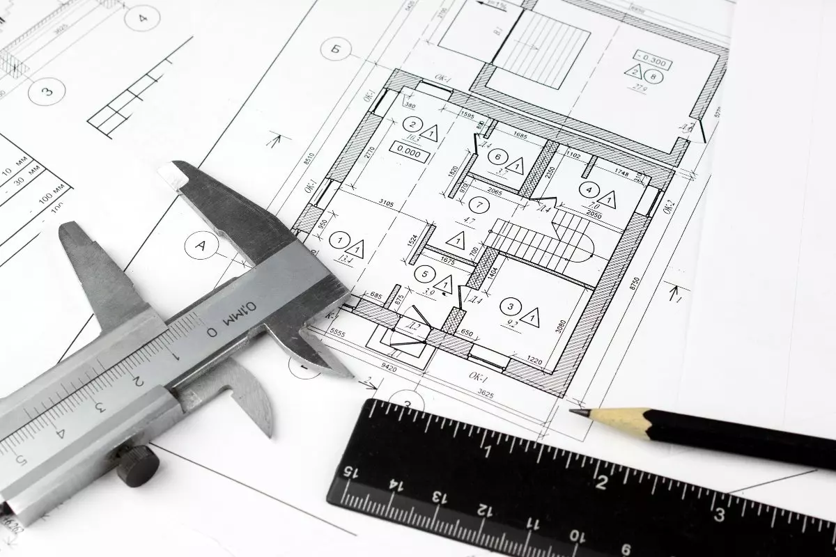 Close up on blueprint of house and ruler 