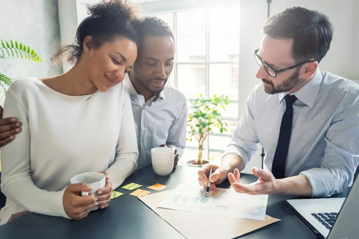 Couple meeting with real estate agent