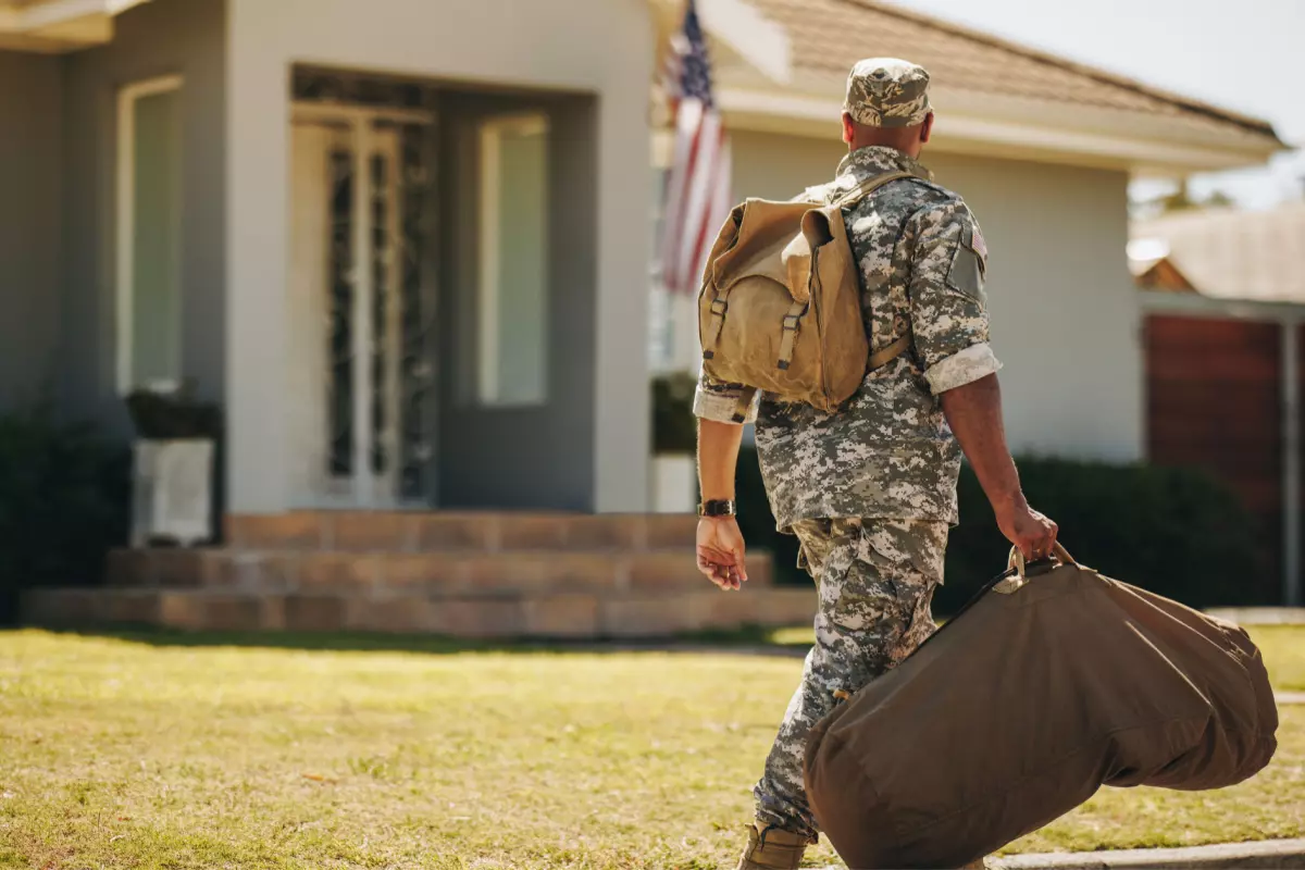 Military member walking away from rental house