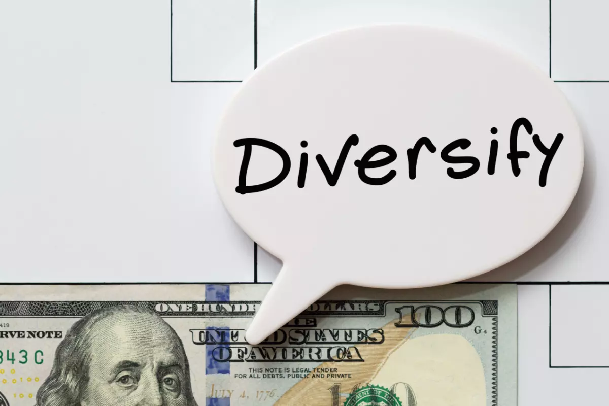 Diversify text next to $100 bill