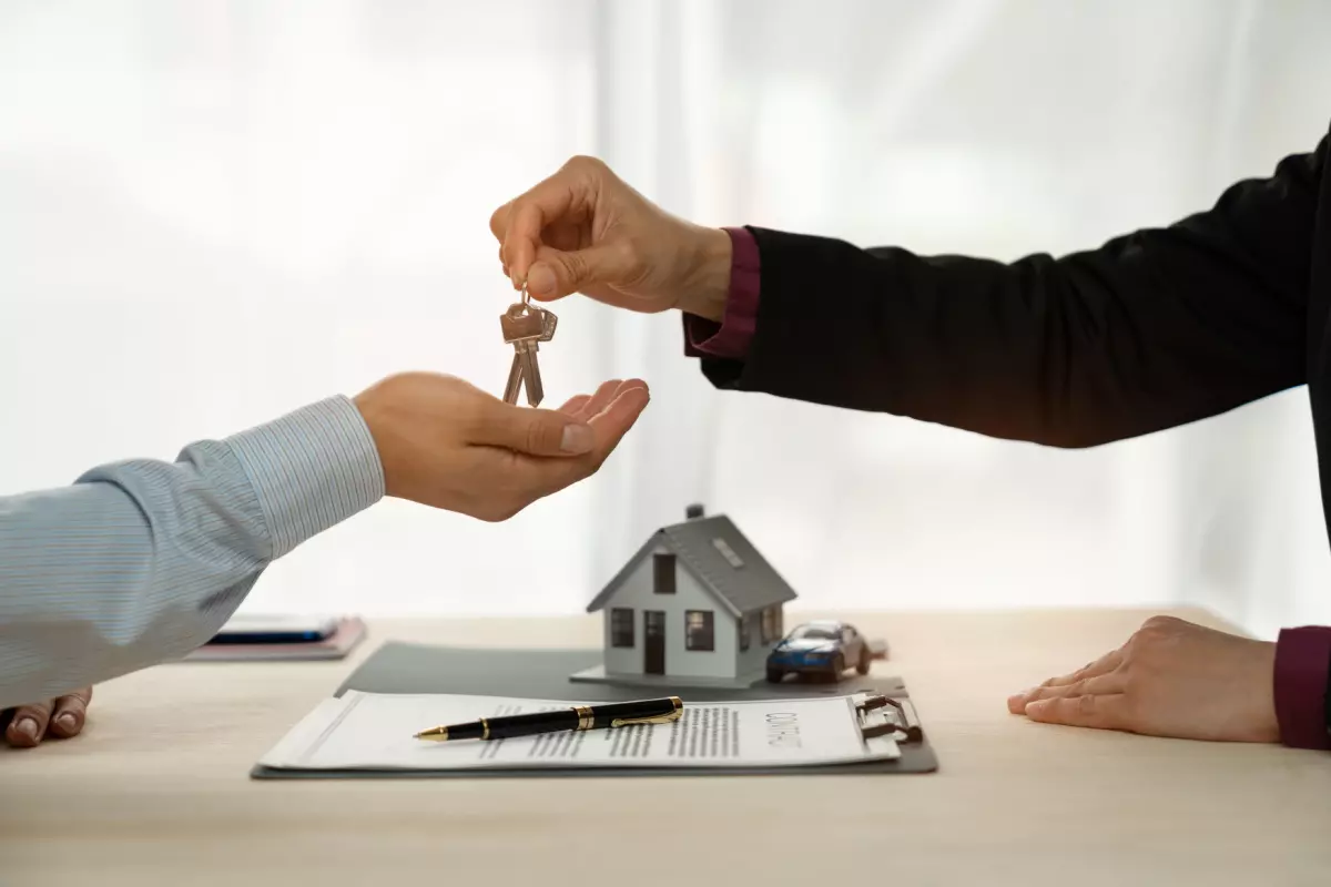 Investor taking keys after finalizing tax lien investment 