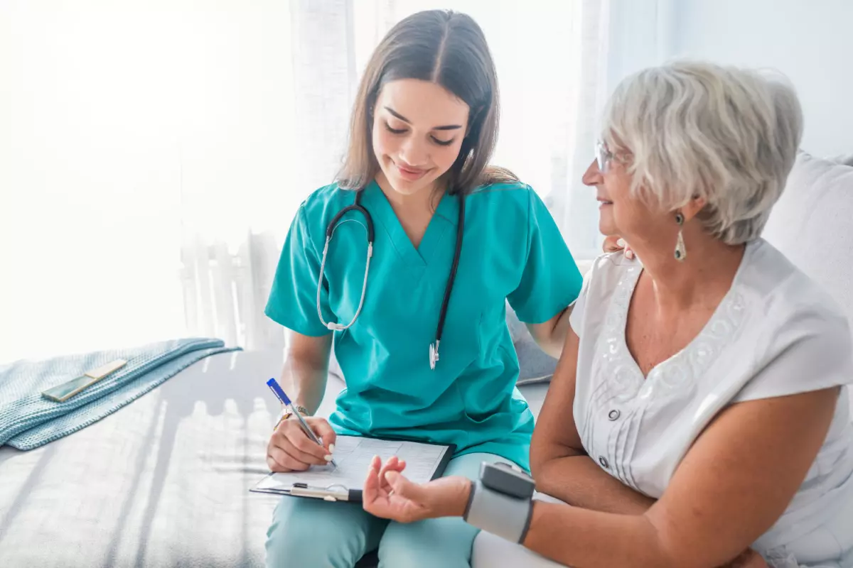 Medical assistant taking patient's vitals