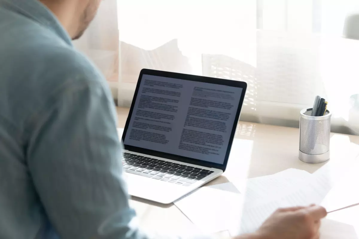 Technical writer working on laptop